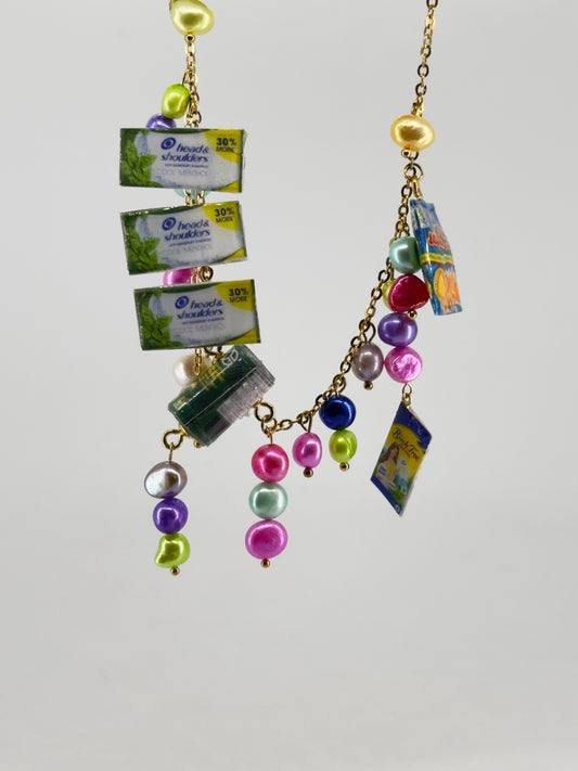 Sari Sari Essentials Shampoo, Ligo Sardines, Birch Tree, Sinigang Mix, and Mr. Chips Chain Necklace