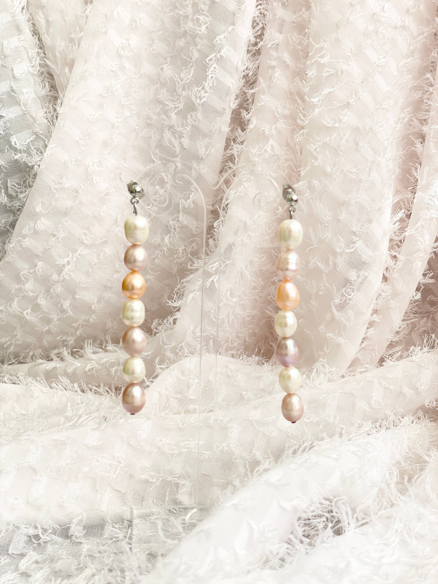 Dangling Pearls in Neutral Colours